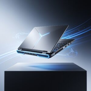 High-end gaming laptop with vibrant RGB backlit keyboard and a glowing screen displaying a futuristic game scene