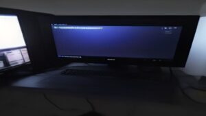 A gaming PC screen shows a vibrant game scene with overlay graphs of FPS rise, AI neural network icons, and a sleek dashboard.