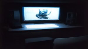High-performance PC with liquid cooling glowing components abstract benchmark graphs floating sleek modern workspace